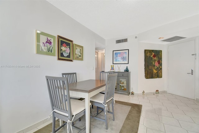 view of tiled dining space