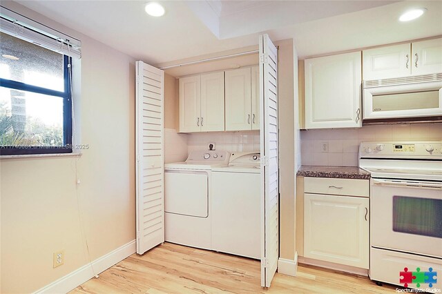 1036 US Highway 1 Unit 216, North Palm Beach, FL 33408 - laundry room featuring light wood finished floors, recessed lighting, baseboards, and washing machine and clothes dryer