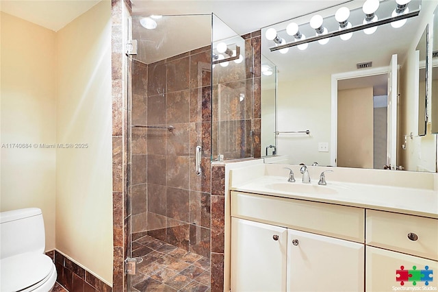 1036 US Highway 1 Unit 216, North Palm Beach, FL 33408 - full bathroom featuring toilet, a stall shower, visible vents, and vanity