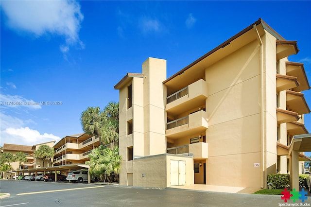 1036 US Highway 1 Unit 216, North Palm Beach, FL 33408 - view of building exterior featuring covered parking