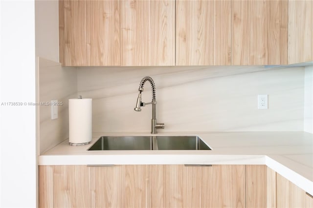 room details with sink and light brown cabinets