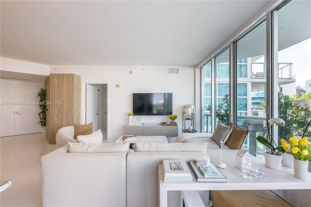 living room with floor to ceiling windows