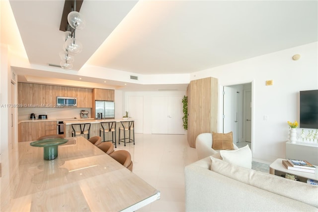 living room with light tile patterned floors