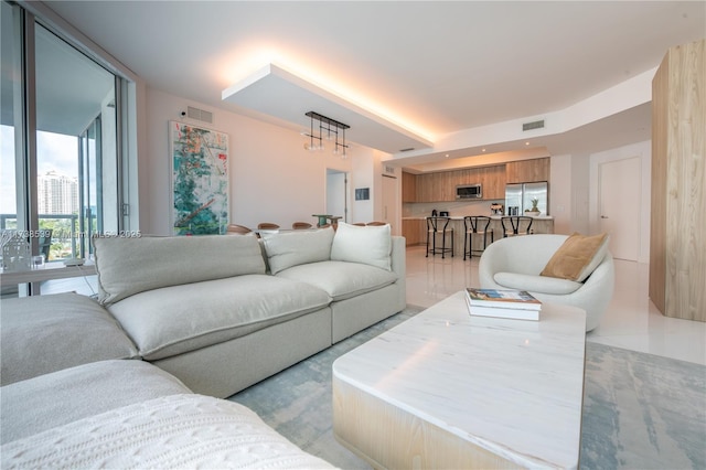 living room with floor to ceiling windows