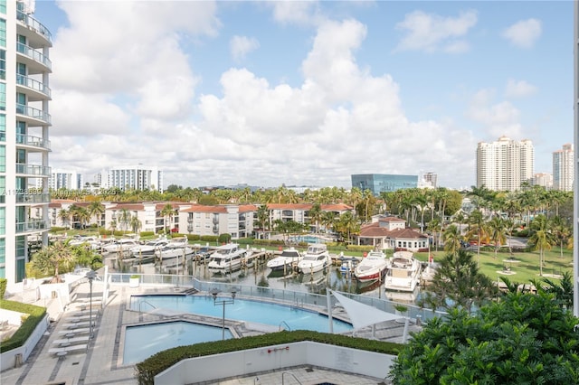 view of pool featuring a water view