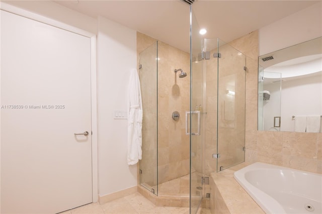 bathroom with tile patterned floors and plus walk in shower