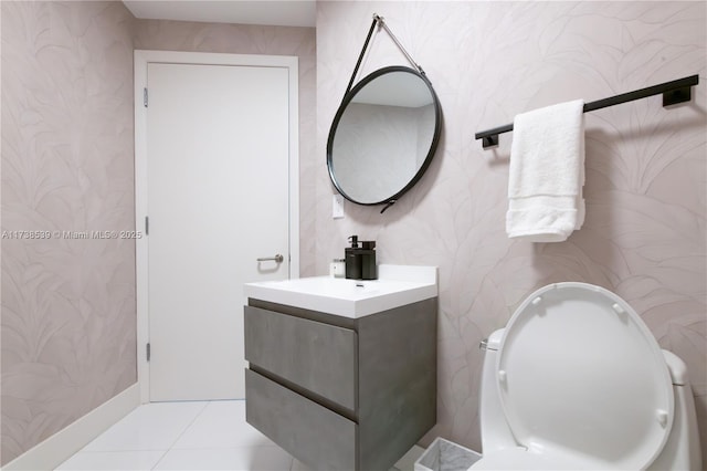 bathroom with vanity, tile patterned floors, and toilet