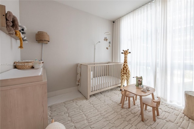 bedroom with a nursery area