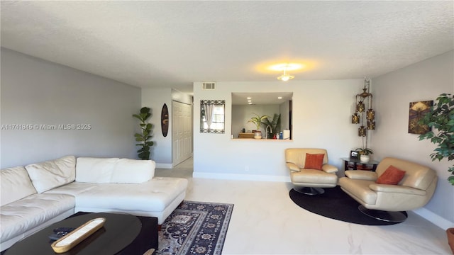 living room with visible vents, a textured ceiling, and baseboards