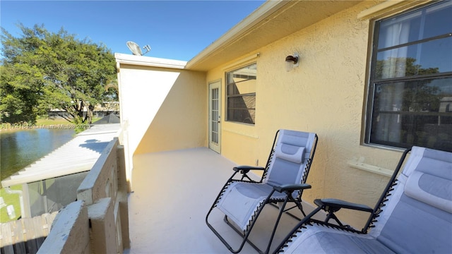 view of patio featuring a balcony