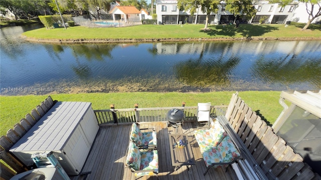 exterior space with a yard and a water view