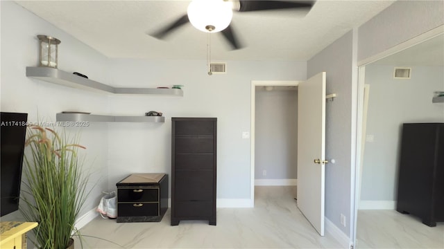 bathroom with visible vents, baseboards, marble finish floor, and ceiling fan