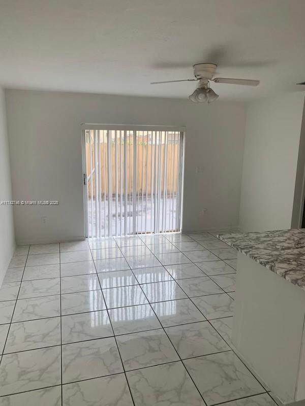 empty room with ceiling fan