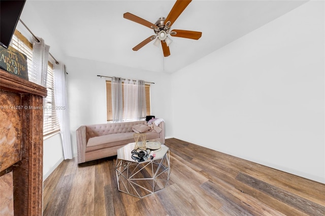 living room with hardwood / wood-style floors and ceiling fan