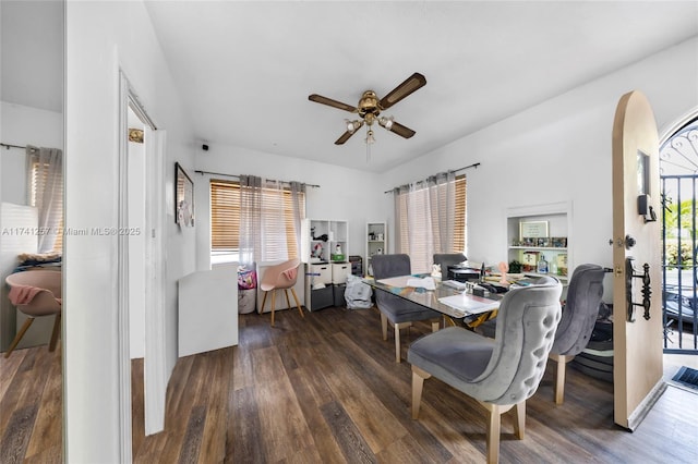 dining area with ceiling fan and dark hardwood / wood-style flooring