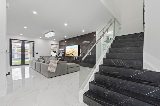 stairs featuring french doors