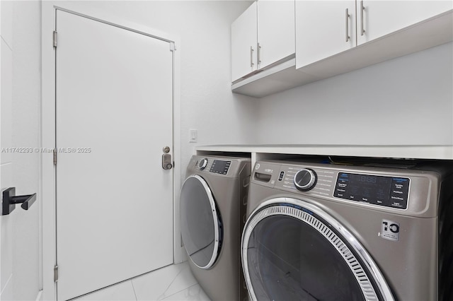 washroom with cabinets and separate washer and dryer