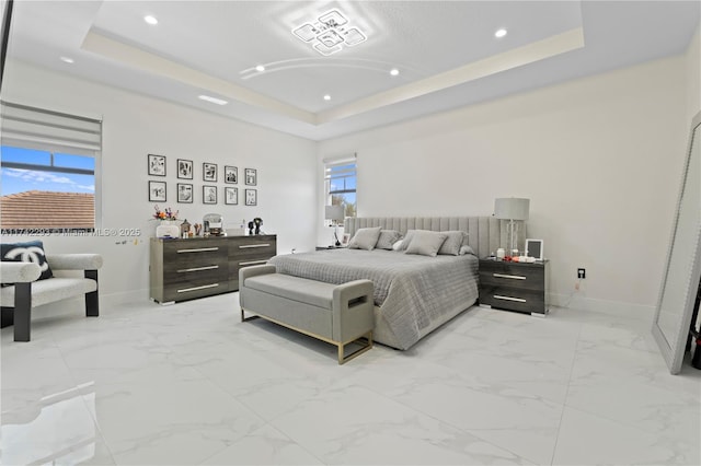 bedroom featuring a raised ceiling