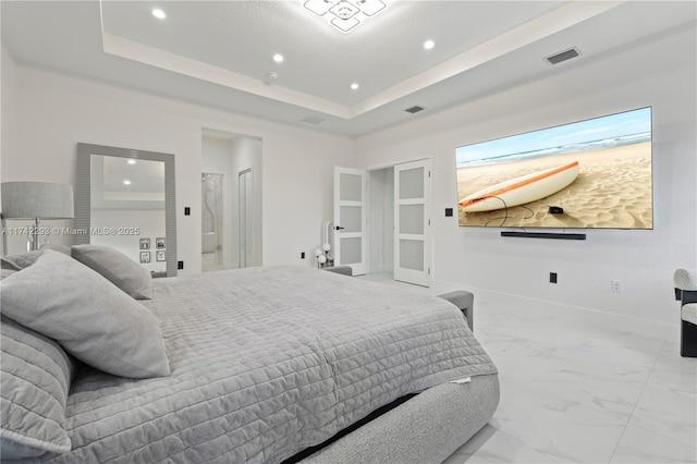 bedroom featuring a tray ceiling