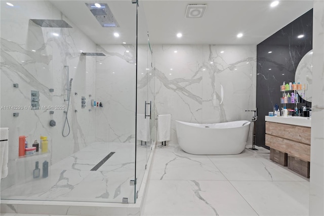 bathroom featuring vanity and shower with separate bathtub