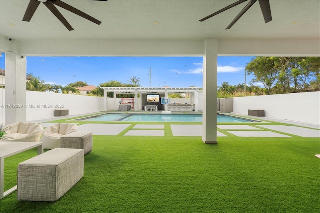 view of pool with an outdoor living space, a yard, and a pergola