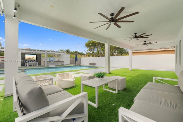 view of patio with ceiling fan, an outdoor hangout area, and a fenced in pool