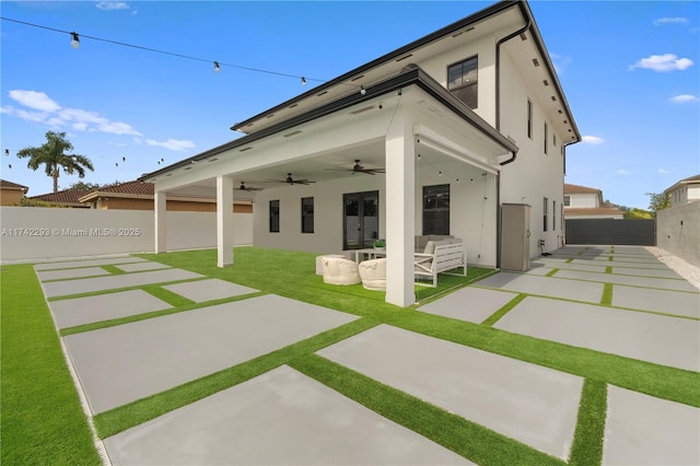 back of house with a patio area and ceiling fan