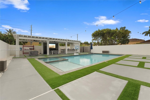 view of swimming pool featuring an in ground hot tub and a patio