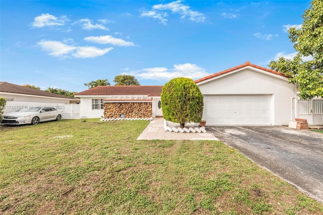 ranch-style home featuring a garage and a front yard