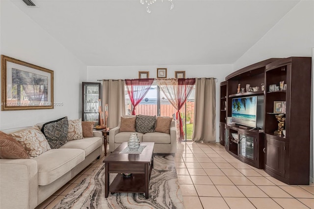 living room featuring light tile patterned flooring and lofted ceiling