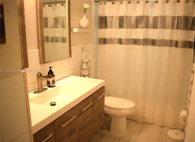 full bath with vanity, tile walls, toilet, and a shower with shower curtain