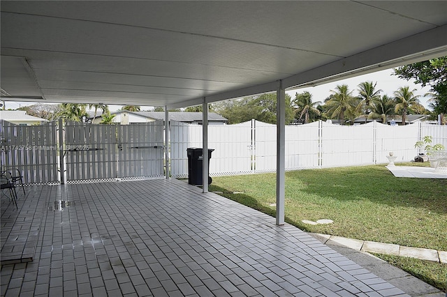 view of patio featuring fence private yard and a gate