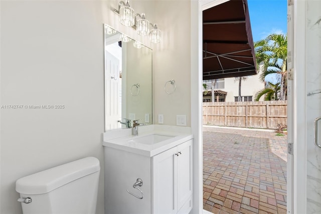 bathroom with vanity and toilet