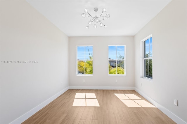 spare room with light hardwood / wood-style flooring