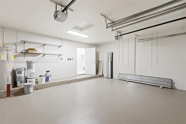 garage featuring a garage door opener and water heater