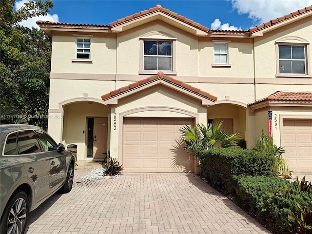 mediterranean / spanish-style house featuring a garage