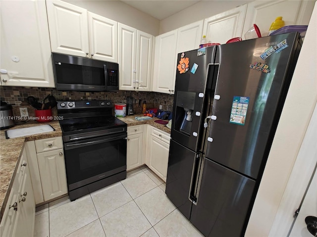 kitchen featuring refrigerator with ice dispenser, electric range, white cabinets, and backsplash