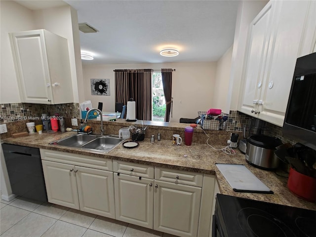 kitchen with sink, white cabinetry, kitchen peninsula, decorative backsplash, and black appliances