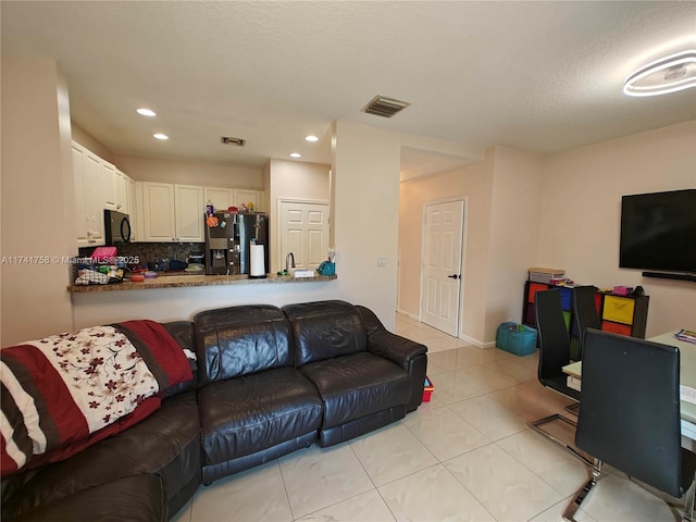 living room with light tile patterned floors