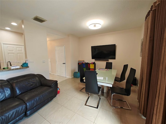 living room with light tile patterned floors