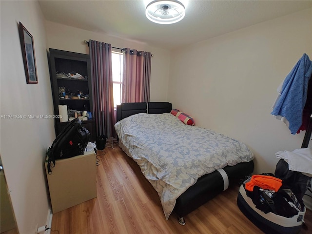 bedroom with light hardwood / wood-style floors