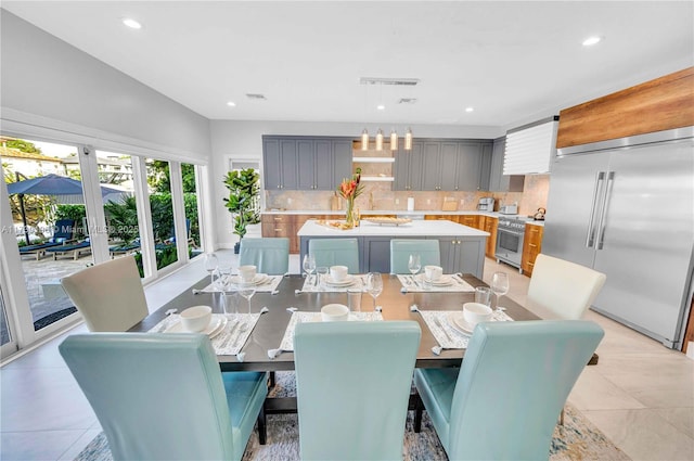 dining area with light tile patterned flooring