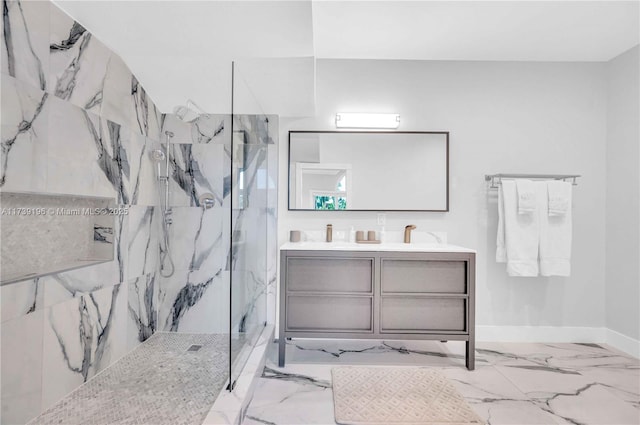 bathroom with vanity and tiled shower