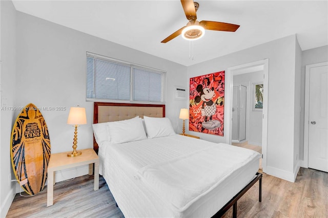 bedroom featuring ceiling fan and light hardwood / wood-style flooring