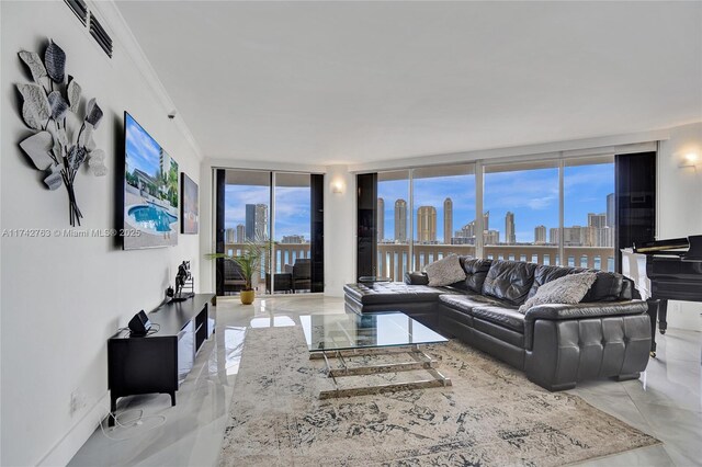 living room with ornamental molding and floor to ceiling windows