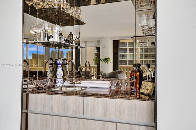 interior space featuring sink and light brown cabinetry