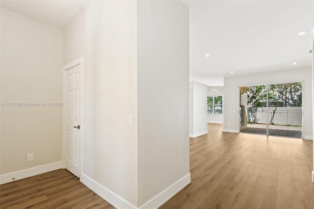 hallway featuring hardwood / wood-style flooring