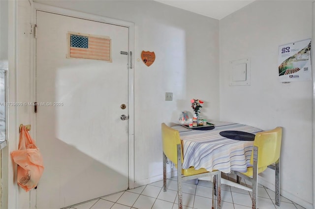 dining area with light tile patterned floors