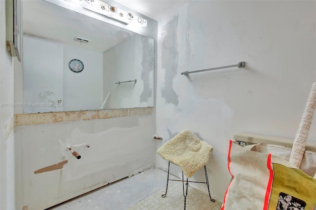 bathroom featuring concrete floors