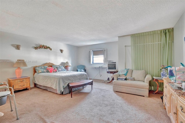 carpeted bedroom with a textured ceiling